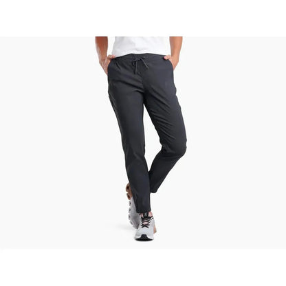 A front view of the Kuhl Women's Haven Joggr in Black with a drawstring waist, model wearing them, and a plain white background.