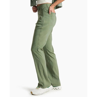 Side view of the Kuhl Women's Haven Pant in Slate Green showing the front pocket and white sneakers against a white background.