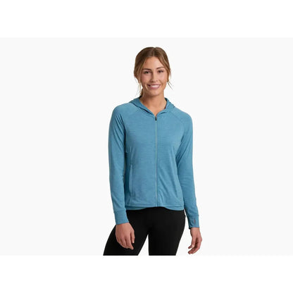 A front view of the Kuhl Women's Inspira FZ Hoody in Alpine Lake on a model wearing black pants against a white background.