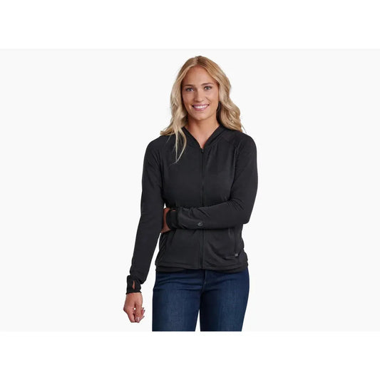 A woman wearing the Kuhl Women's Inspira FZ Hoody in Alpine Lake stands against a plain white background.