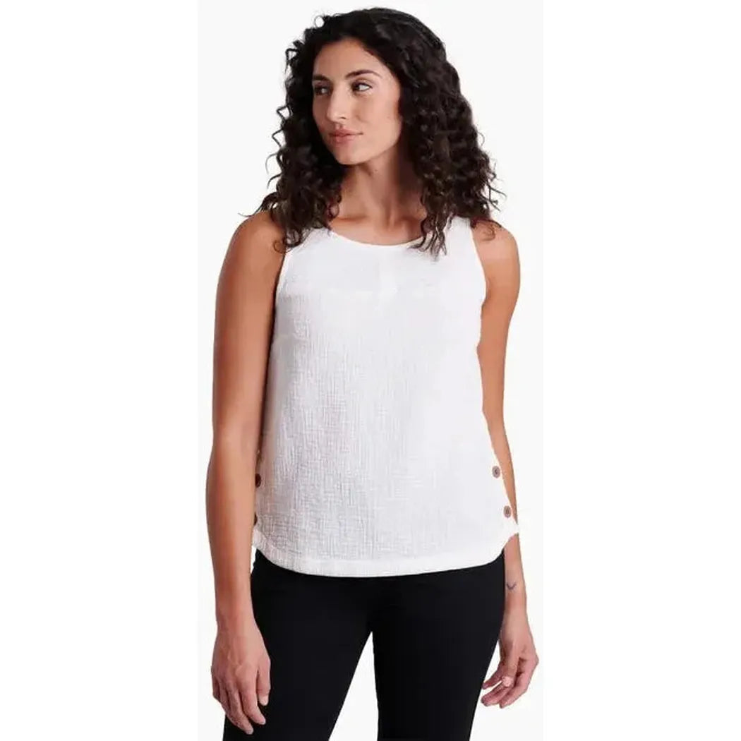 A front view of the Kuhl Women's Klover Tank in Aqua on a model wearing black pants against a white background.
