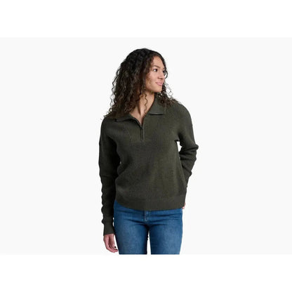 A woman wearing the Kuhl Women's Norda 1/4 Zip Sweater in Stone stands against a white background.