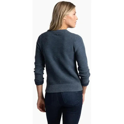 Back view of the Kuhl Women's Sofie Sweater in Metal Blue on a model wearing dark pants against a white background.