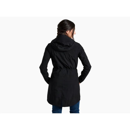 Back view of the Kuhl Women's Stretch Voyagr Trench in Blackout, showing the hood and belted waist on a model against a white background.