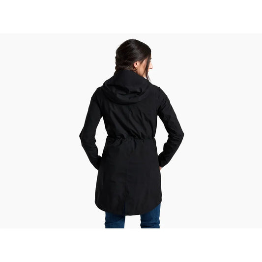 Back view of the Kuhl Women's Stretch Voyagr Trench in Blackout, showing the hood and belted waist on a model against a white background.