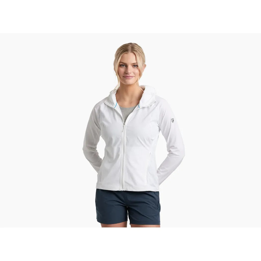A woman wearing the Kuhl Women's Sunshade Hoody in Alpine White stands against a white background.