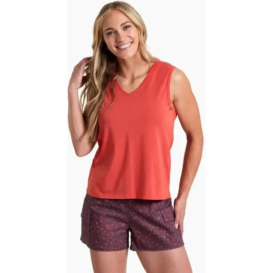 A woman wearing the Kuhl Women's Vega Tank in Sunset color poses against a white background.