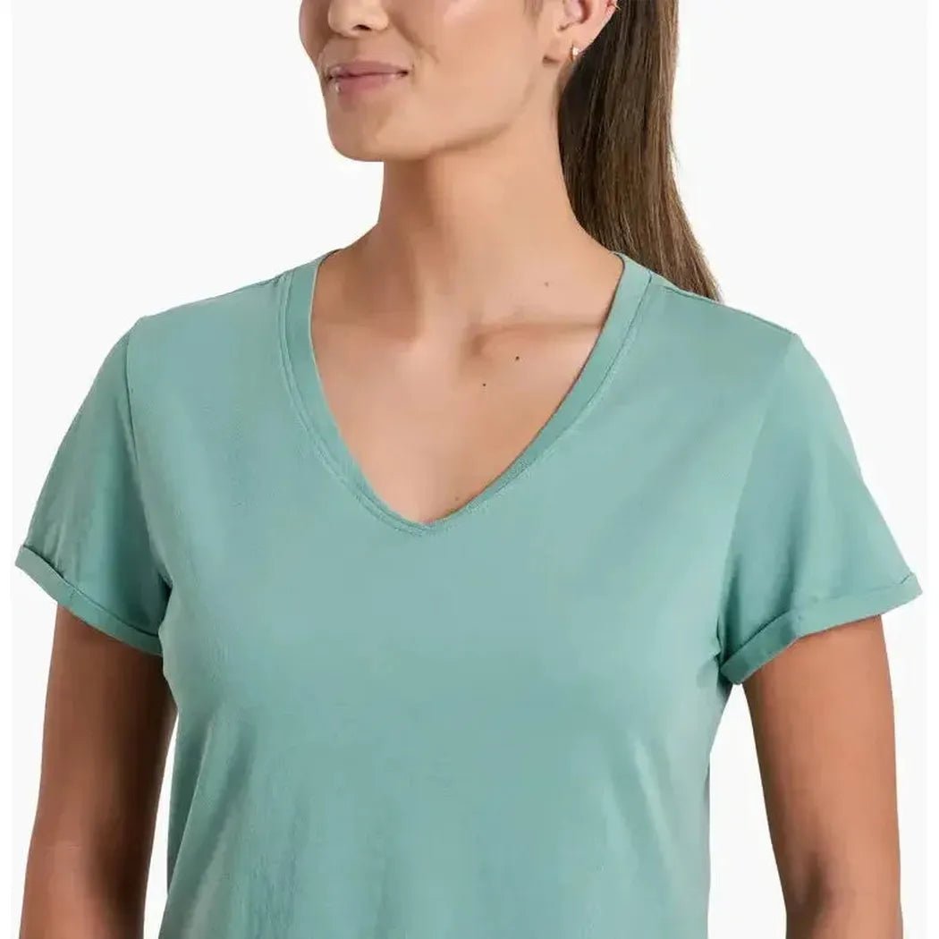 A woman wearing the Kuhl Women's Vega Tee in Dew, shown from the front with a white background.