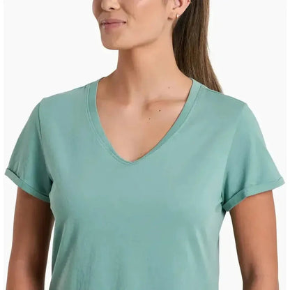 A woman wearing the Kuhl Women's Vega Tee in Dew, shown from the front with a white background.