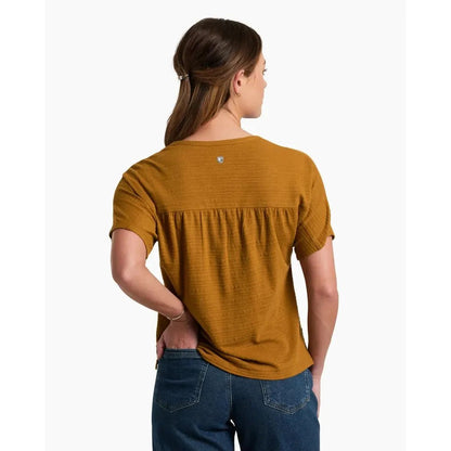 Back view of the Kuhl Women's Willa Short Sleeve in Bronze showing the gathered back detail and model wearing it against a white background.