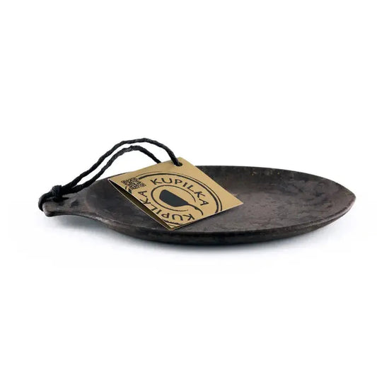 A black Kupilka 14 Small Plate with a tag on a black string against a white background.