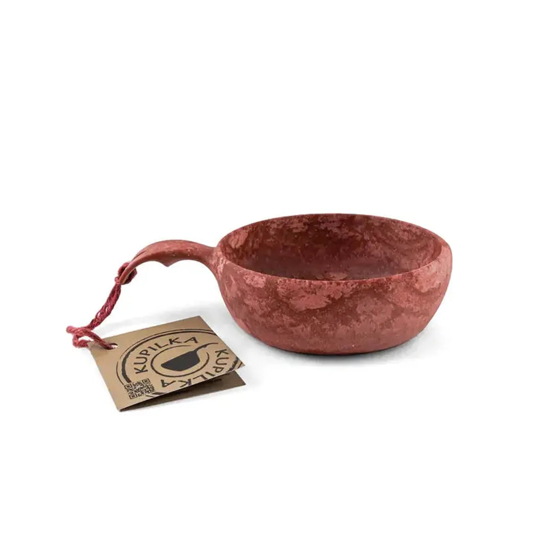 A front view of the Kupilka 33 Junior Soup Bowl in Black with a tag and red string against a white background.