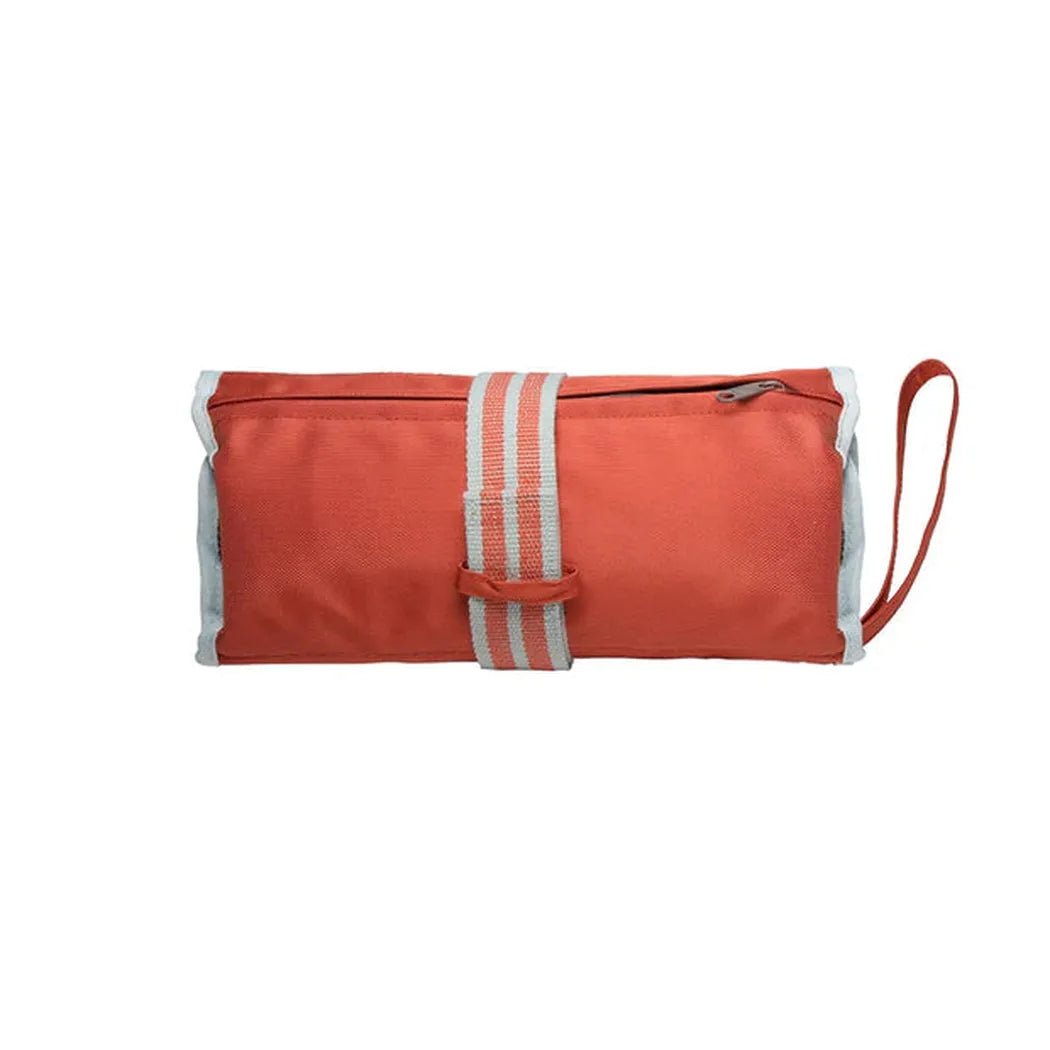 A front view of the Kurgo First Aid Kit in Paprika showing the zip closure and wrist strap against a white background.