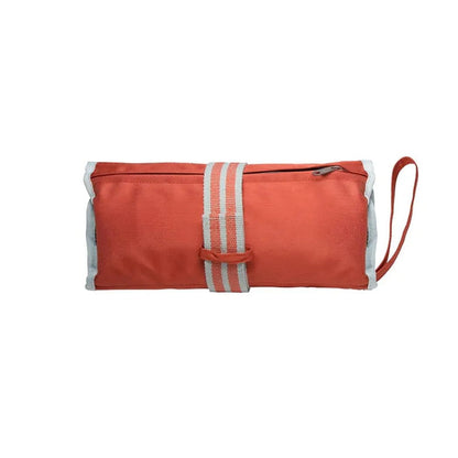 A front view of the Kurgo First Aid Kit in Paprika showing the zip closure and wrist strap against a white background.