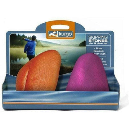 A front view of the Kurgo Skipping Stones - 2 Pack in Assorted colors showing the floating, non-toxic chew toy against a lake background.