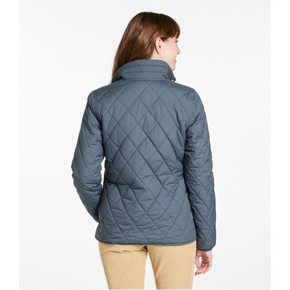 Back view of the L.L.Bean Display Sample - Women's Bean Cozy Quilted Jacket in Rangeley Blue on a model wearing tan pants against a white background.