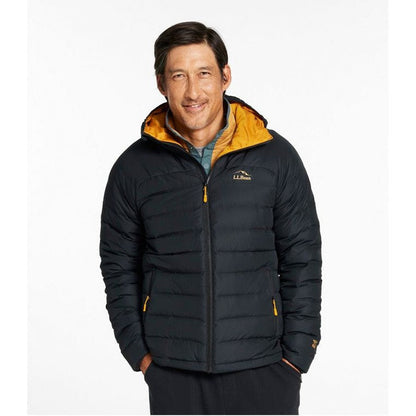 A front view of the L.L.Bean Men's Bean's Down Hooded Jacket in Black with a yellow hood lining, showing the model wearing it against a plain white background.