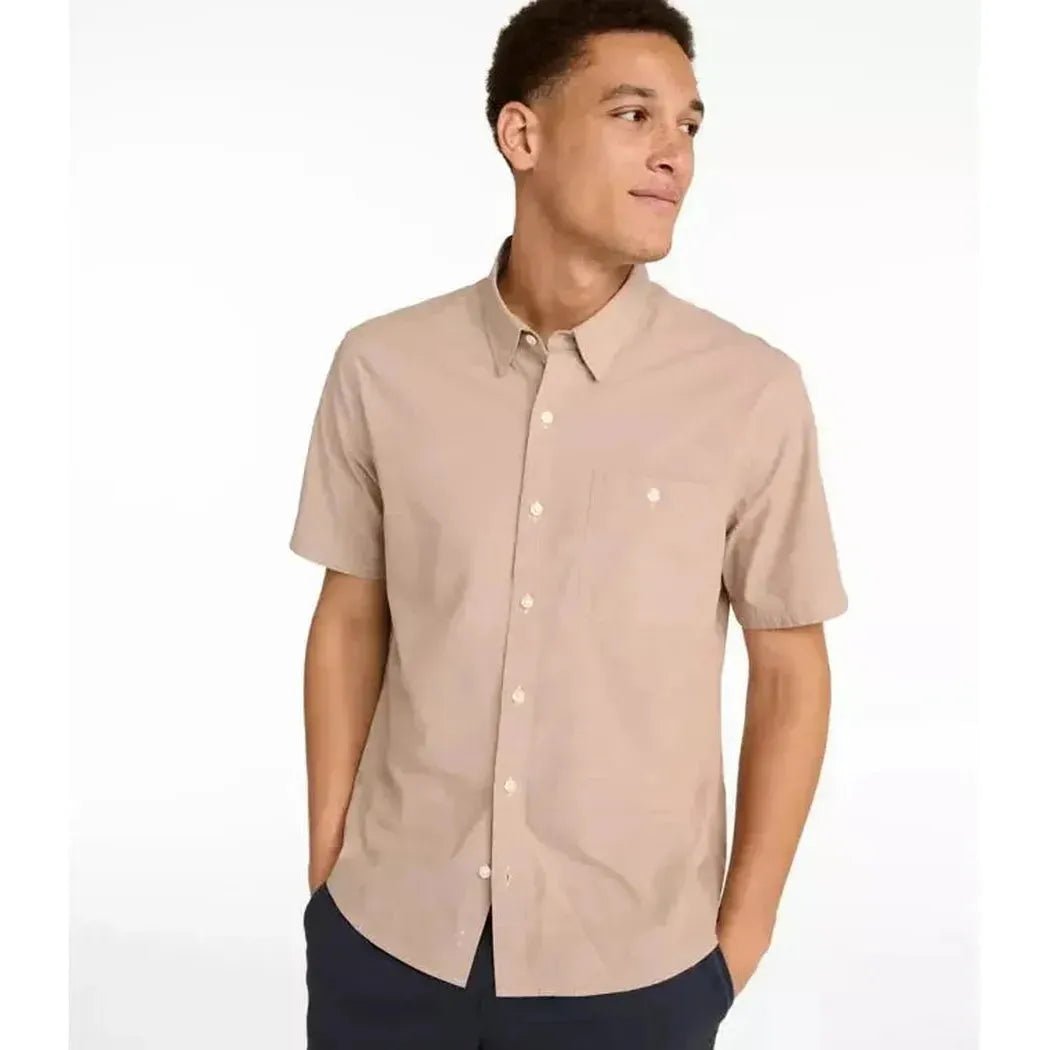 A front view of the L.L.Bean Men's Comfort Stretch Performance Chambray Shirt in Camel Brown with a model wearing it against a white background.