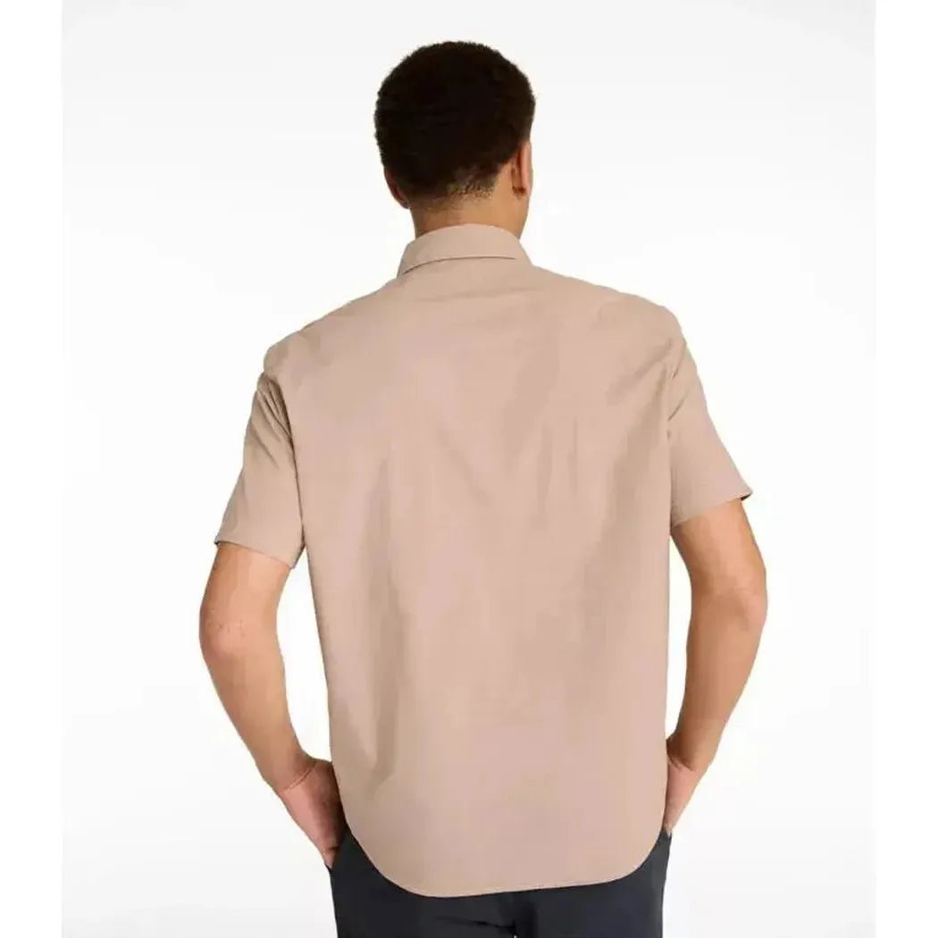 Back view of the L.L.Bean Men's Comfort Stretch Performance Chambray Shirt in Camel Brown on a model against a white background.