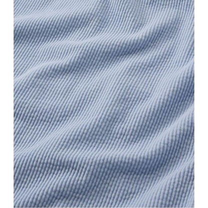 A close-up of the L.L.Bean Women's Comfort Corduroy Relaxed Shirt Long Sleeve in Carbon Navy showing the ribbed texture and soft fabric.