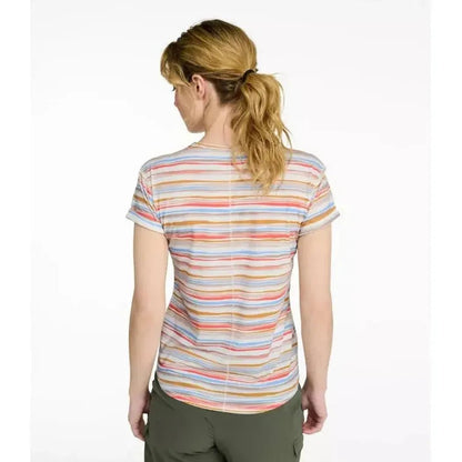 Back view of the L.L.Bean Women's Everyday SunSmart Lifestyle Tee, Short-Sleeve Print in Sea Salt Retro Stripe on a model wearing olive pants against a white background.