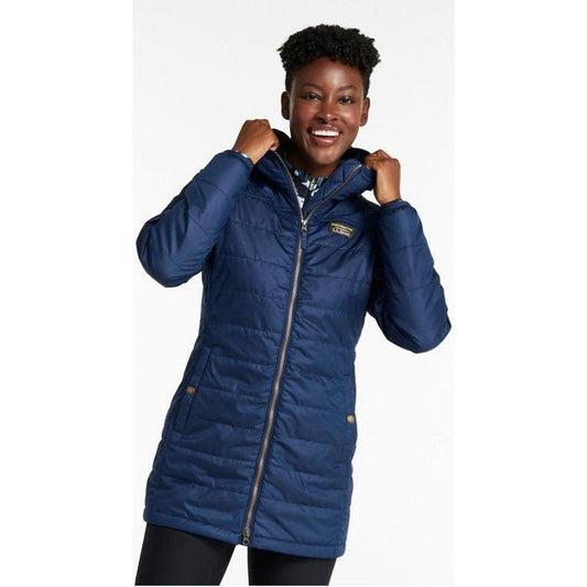 A model wearing the L.L.Bean Women's Mountain Classic Puffer Coat in Nautical Navy poses against a white background.