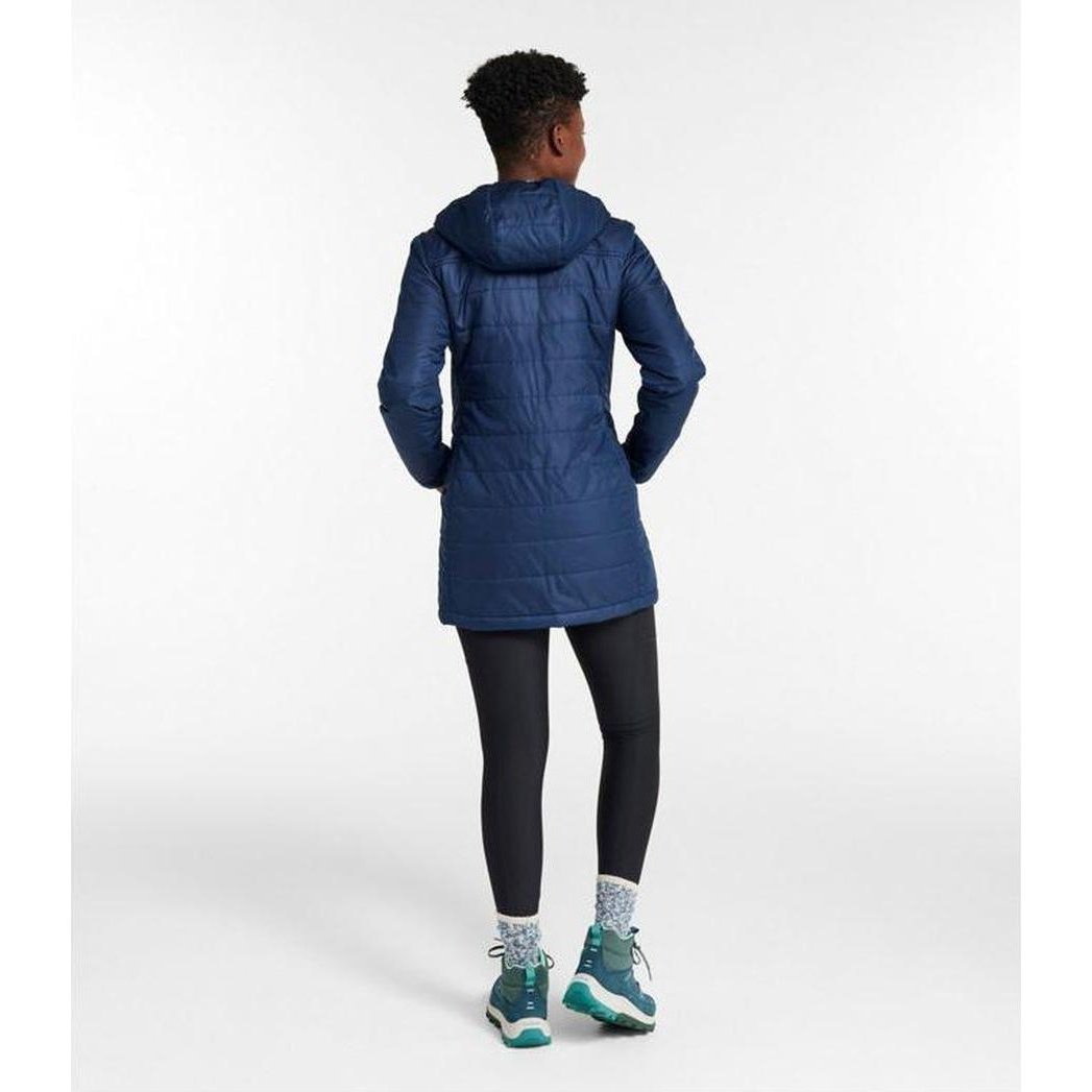 Back view of the L.L.Bean Women's Mountain Classic Puffer Coat in Nautical Navy on a model against a white background.