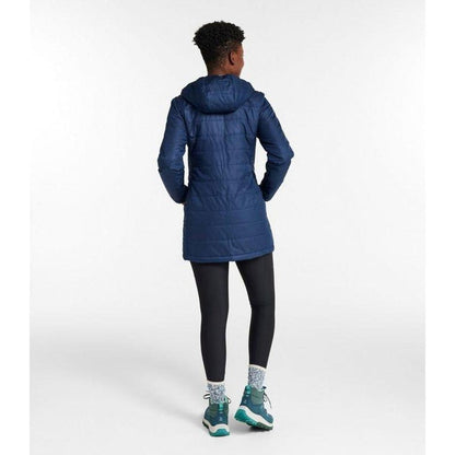 Back view of the L.L.Bean Women's Mountain Classic Puffer Coat in Nautical Navy on a model against a white background.