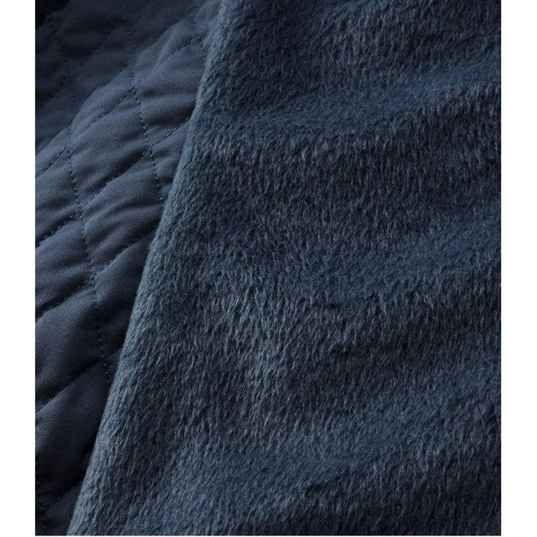 A close-up of the L.L.Bean Women's Regular Fleece Lined Primaloft Jacket in Carbon Navy showing the quilted and fleece-lined fabric.
