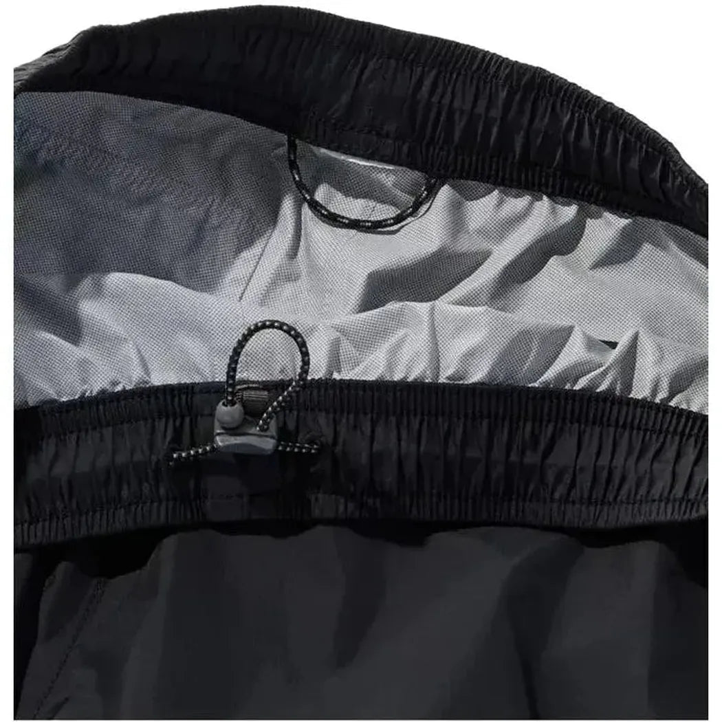 Close-up of the L.L.Bean Women's Trail Model Rain Pants in Black showing the elastic waistband and drawcord closure against a white background.