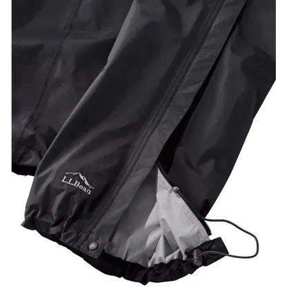 A close-up of the L.L.Bean Women's Trail Model Rain Pants in Black showing the elastic cuff and drawstring against a white background.