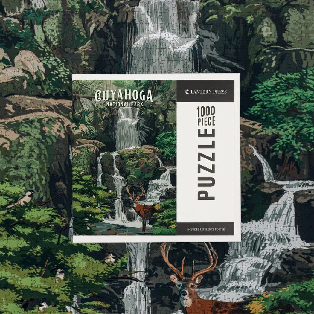 A 1000 piece puzzle of Cuyahoga Valley National Park Deer Falls by Lantern Press is shown with a deer in the foreground.