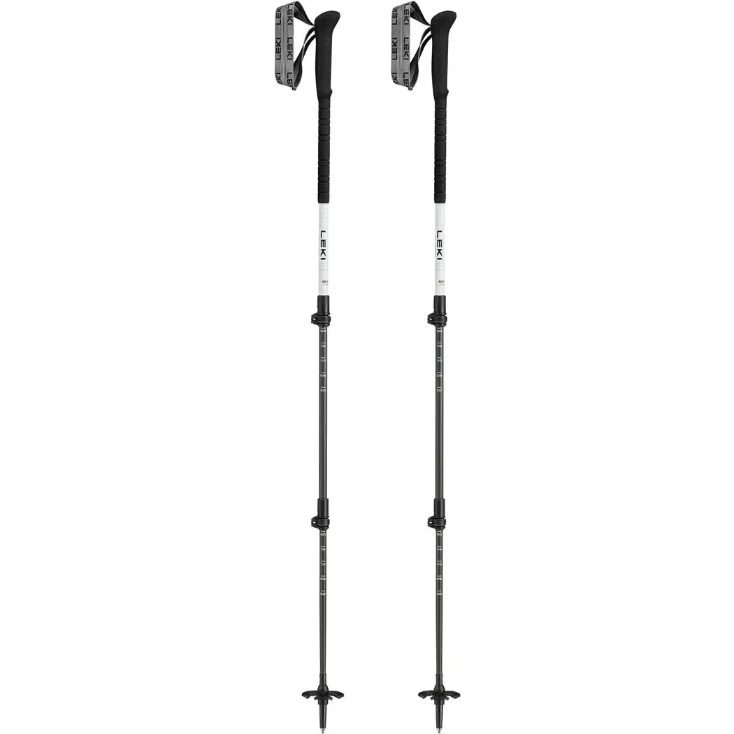 Two Leki Skytera Carbon Lite trekking poles in charcoal/graphite with adjustable sections and cross-shaped tips against a white background.