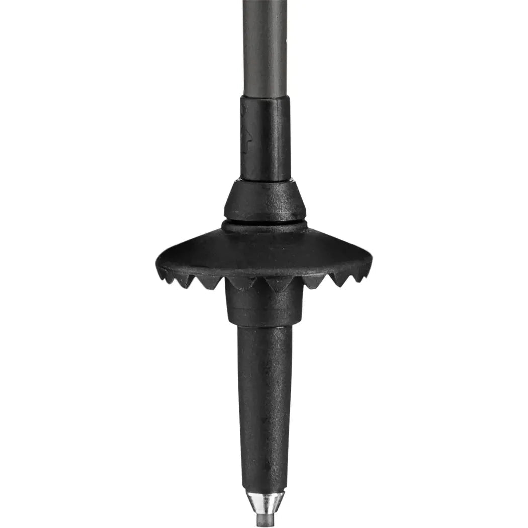 A close-up of the Leki Skytera Carbon Lite trekking pole tip with a serrated rubber base and metal point, photographed against a white background.