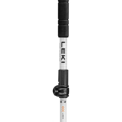 A side view of the Leki Skytera FX Carbon SL trekking pole with a black grip and white shaft against a plain white background.
