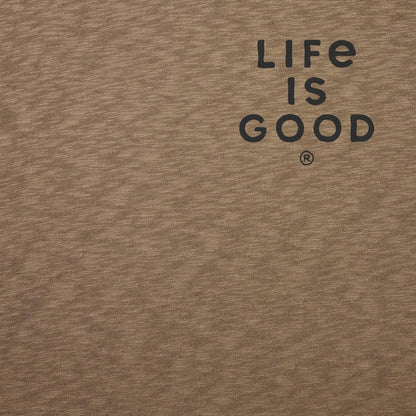A close-up of the Life is Good Men's Mountain Landscape Short Sleeve Slub Slim Fit Tee in Mushroom Brown showing the "Life is Good" logo on the chest.