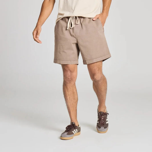 A front view of the Life is Good Men's Solid Weekender Short in Mushroom Brown on a model against a plain background.