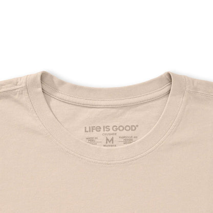 A close-up of the Life is Good Women's Collection of Mushrooms Short Sleeve Crusher Tee in Birch White showing the neck label against a white background.