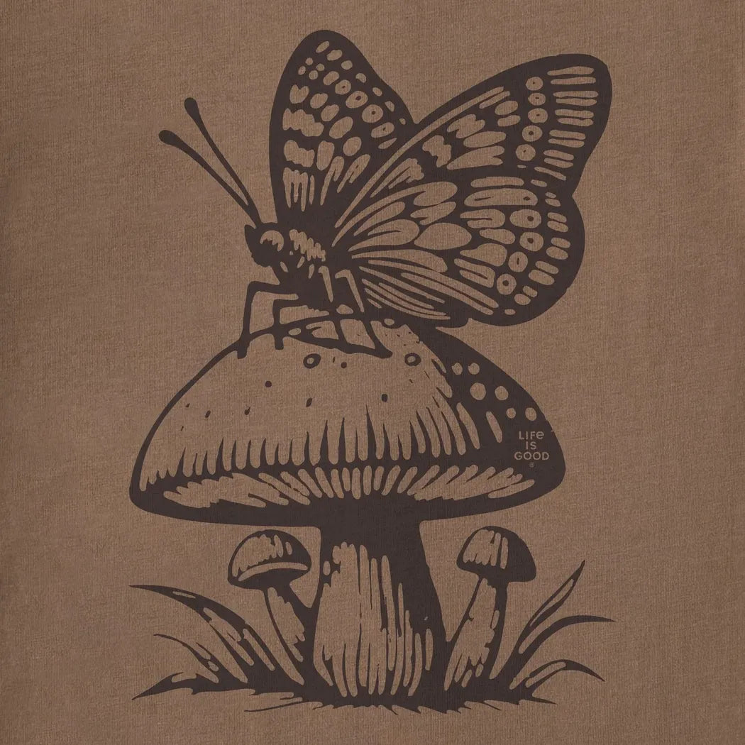 A butterfly sits on a mushroom graphic on the Life is Good Women's Mushy Butterfly Crusher Tee in Mushroom Brown.