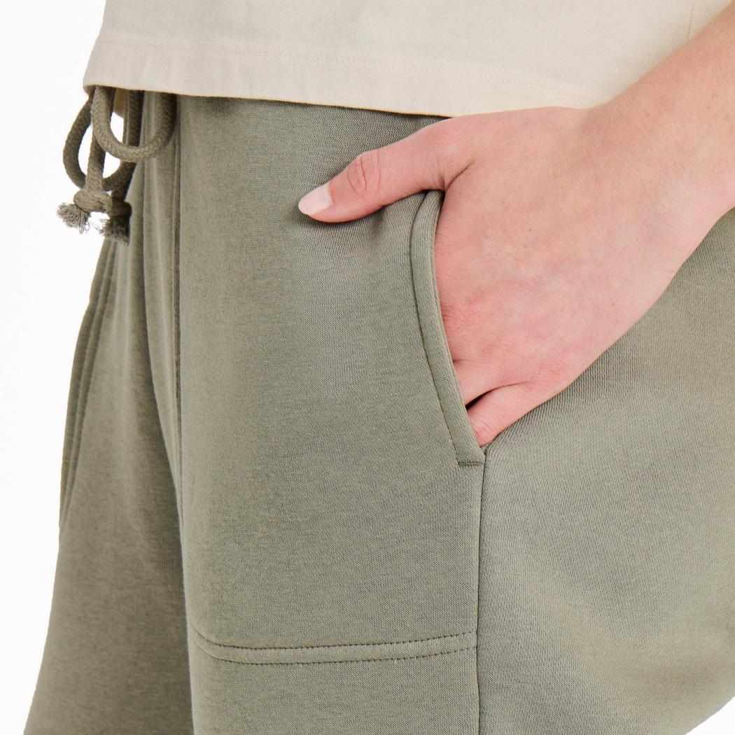 Side view of the Life is Good Women's Solid Vibes Fleece Jogger in Moss Green showing the front pocket and drawstring against a white background.