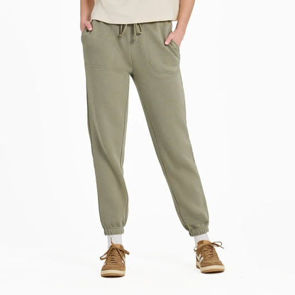 A front view of the Life is Good Women's Solid Vibes Fleece Jogger in Moss Green on a model with a white background.