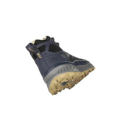 Side view of the Lowa Men's Fortux GTX QC in Navy/Dune showing the lugged outsole against a white background.