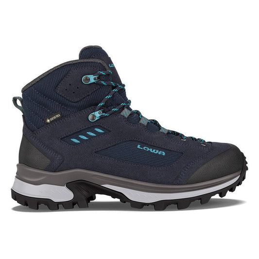 Side view of the Lowa Women's Corvara GTX Mid in Navy/Arctic showing the lugged outsole against a white background.