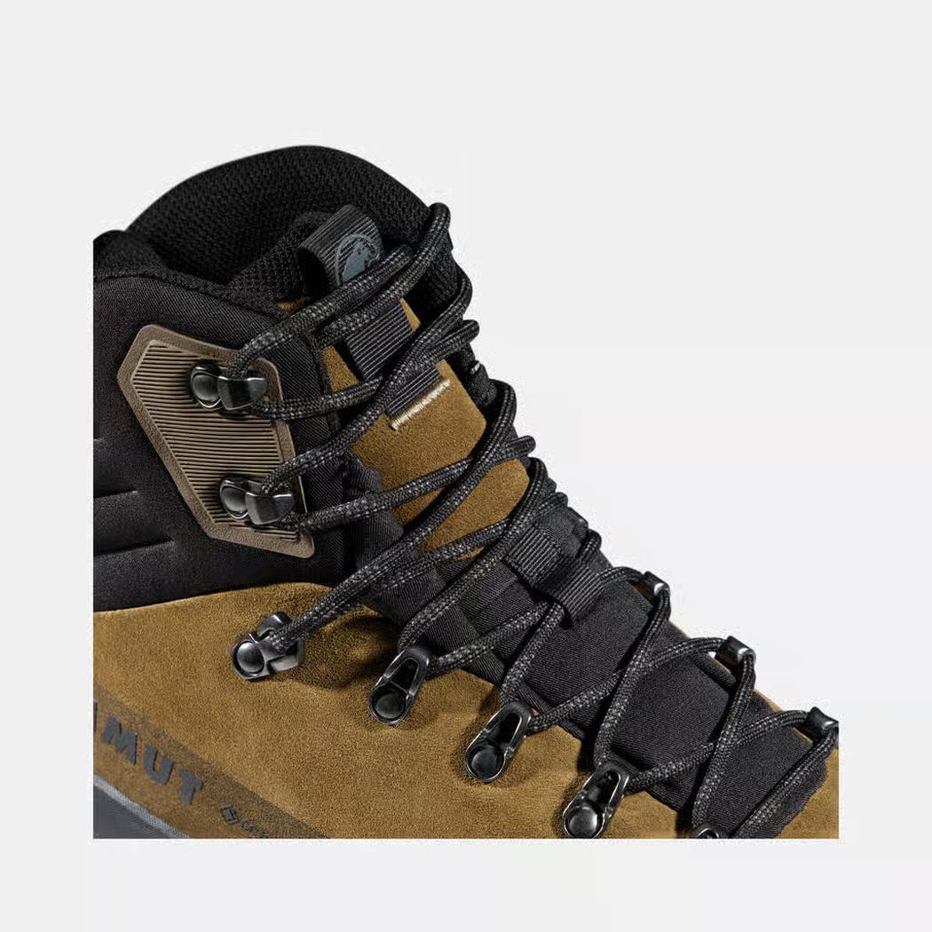 A close-up of the Mammut Ducan III High LTH GTX Men boot in Moor Black, showing the lacing system and side panel against a plain white background.