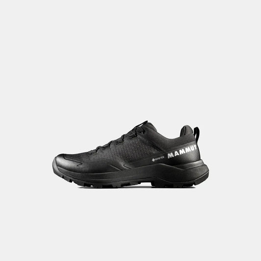 Side view of the Mammut Sertig III Low GTX Men in Gabbro Strata showing the lugged outsole against a white background.