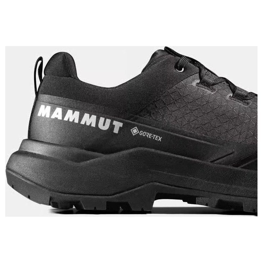 Side view of the Mammut Sertig III Low GTX Men shoe in Gabbro Strata showing the lugged outsole against a white background.