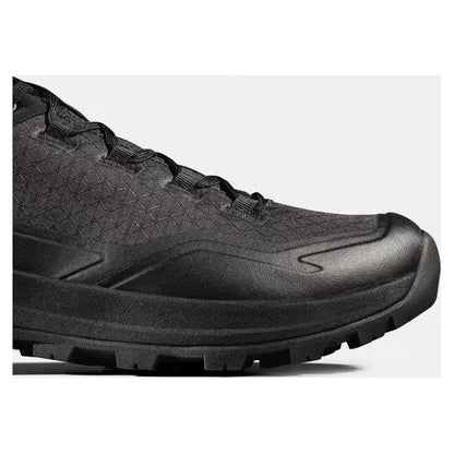 Side view of the Mammut Sertig III Low GTX Men in Gabbro Strata showing the lugged outsole against a light background.