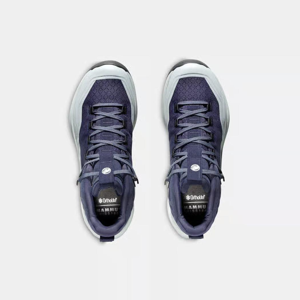 Top view of the Mammut Sertig III Mid GTX Women in AlpineCalaMoonb with laces and tongue branding visible against a white background.