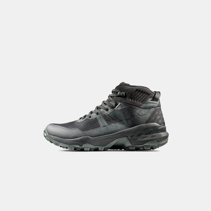 Side view of the Mammut Sports Group Sertig II Mid GTX Men in Black showing the lugged outsole against a white background.