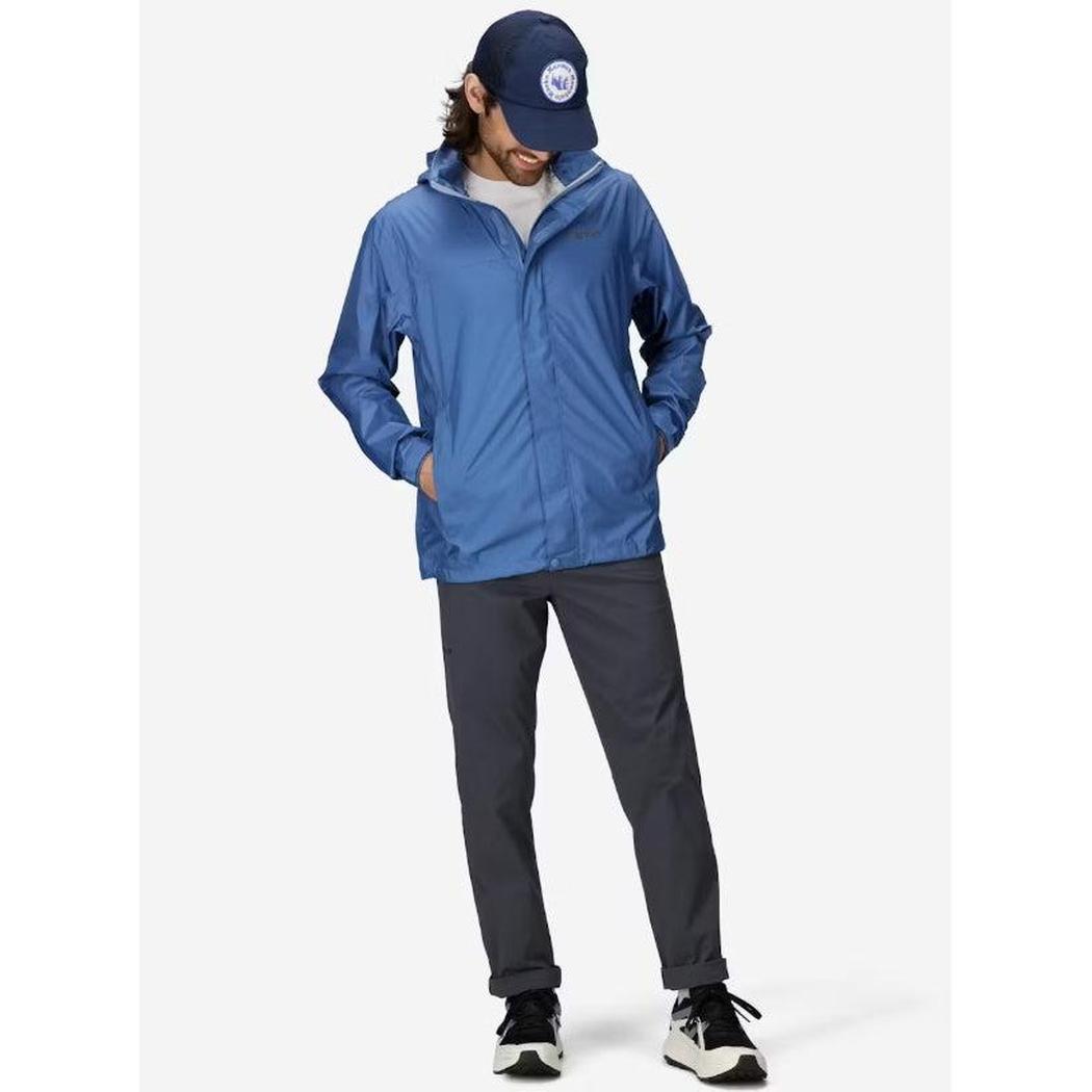 A model wearing the Marmot Men's PreCip Eco Jacket in Arctic Navy stands against a plain white background.